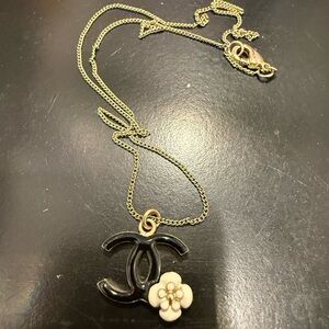 CHANEL Black and Gold Necklace with Iconic Logo and Flower